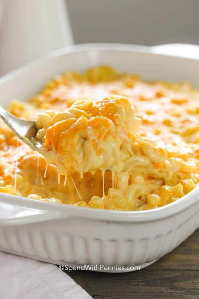 A close up of macaroni and cheese in a white dish